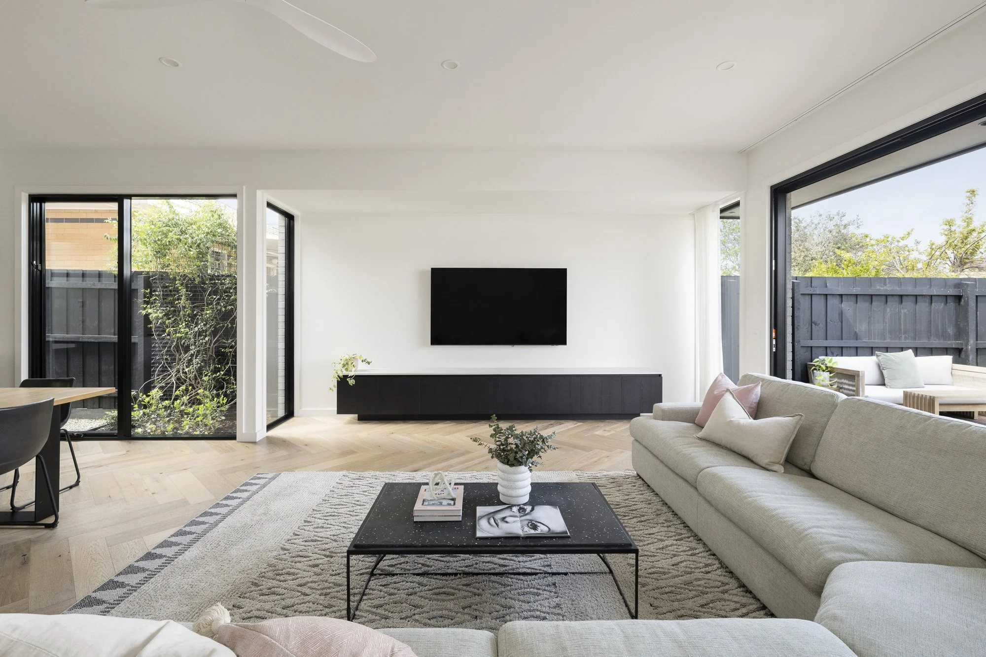 Custom fitted living-room cabinetry at Collins House